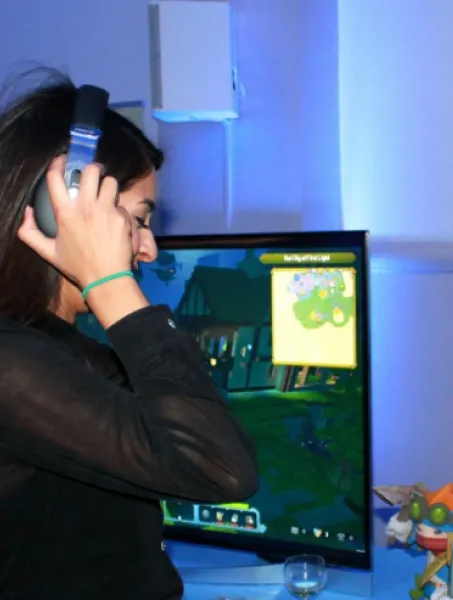 Two women working and laughing with audio equipment