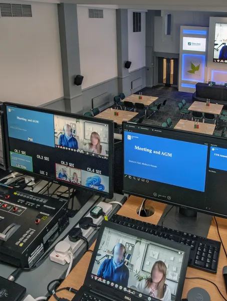 view of computer screens managing at meeting in Woburn Hall