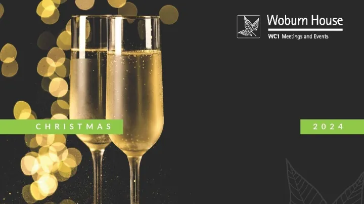 Two champagne flutes against a backdrop of golden bokeh lights, with "Christmas 2024" text. Elegant and festive atmosphere. Woburn House logo in corner.