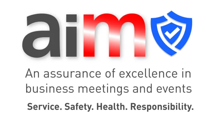 Logo with 'aim' in bold black and red text, next to a blue shield with a checkmark. Below, it reads: 'An assurance of excellence in business meetings and events. Service. Safety. Health. Responsibility.