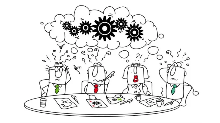 Cartoon of four confused people around a table, with tangled gears in a thought cloud above. Papers and coffee cups scattered; tone is perplexed and chaotic.